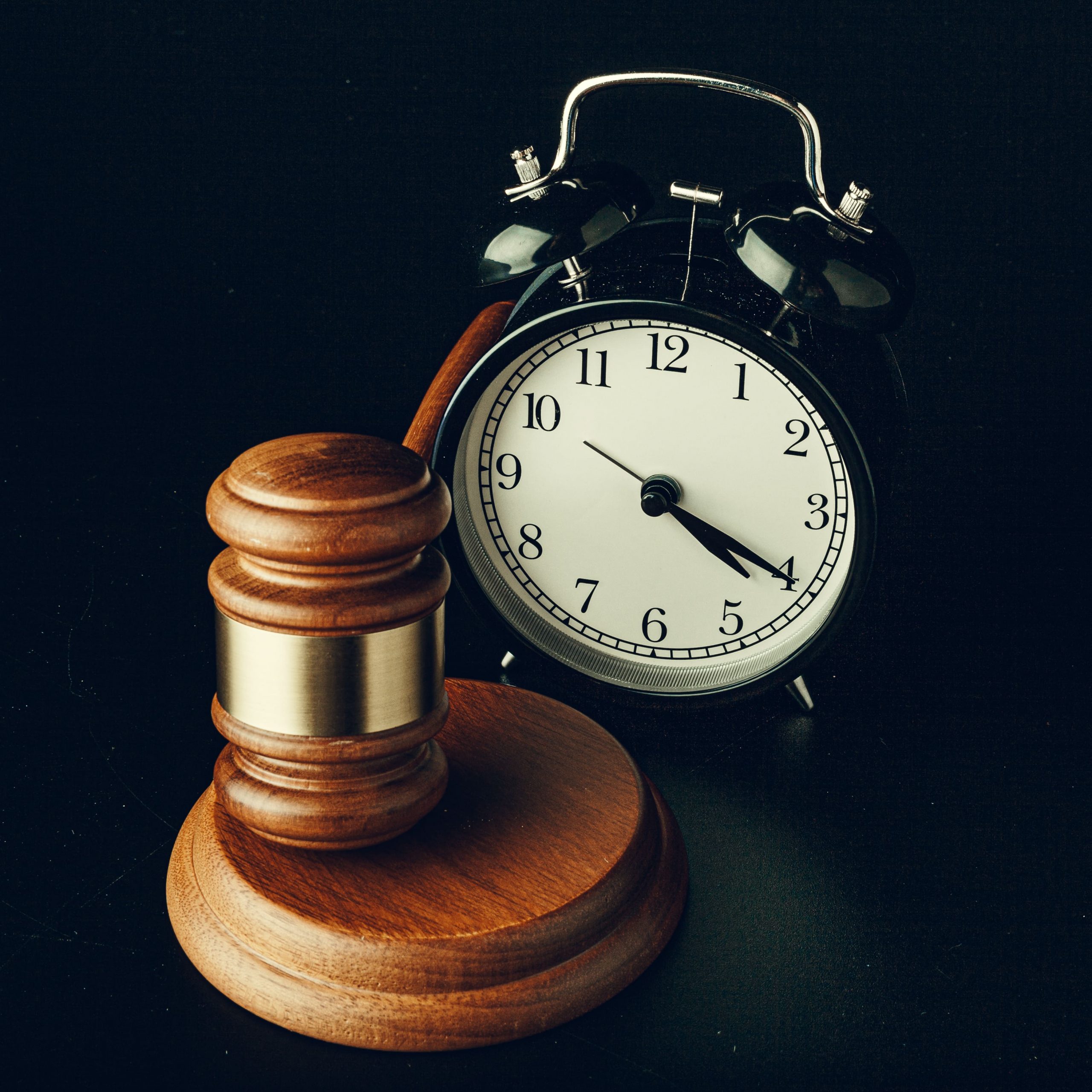 wooden-judge-hammer-with-alarm-clock-on-black-back-2021-09-02-23-12-36-utc (2)